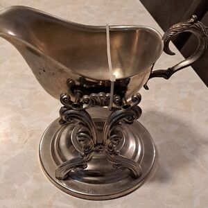 Elegant Silver Gravy Boat with Ornate Handle